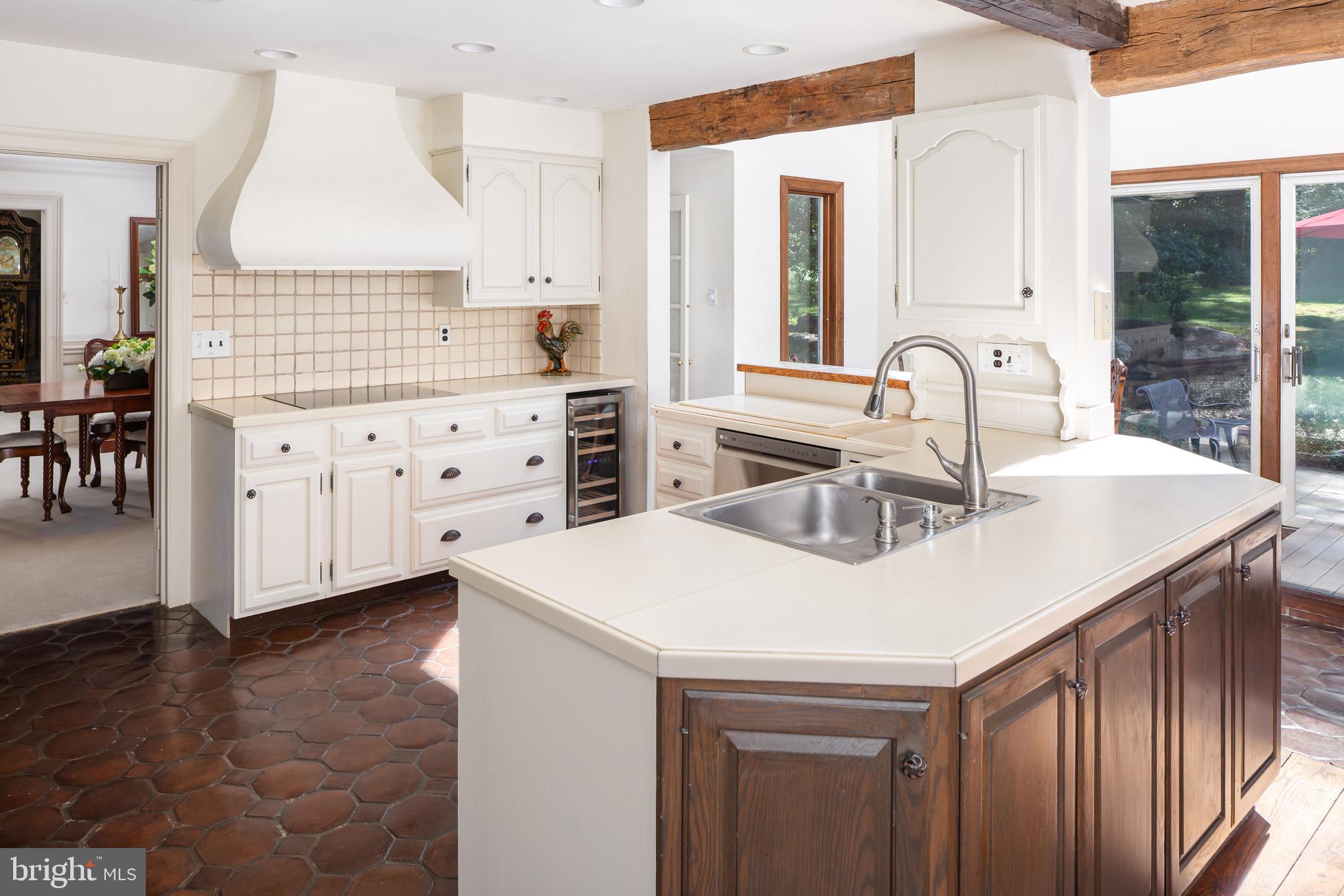 8 Fox Chase Road Malvern, PA 19355 - Photo 17 of 49 a kitchen with granite countertop a sink a stove and cabinets