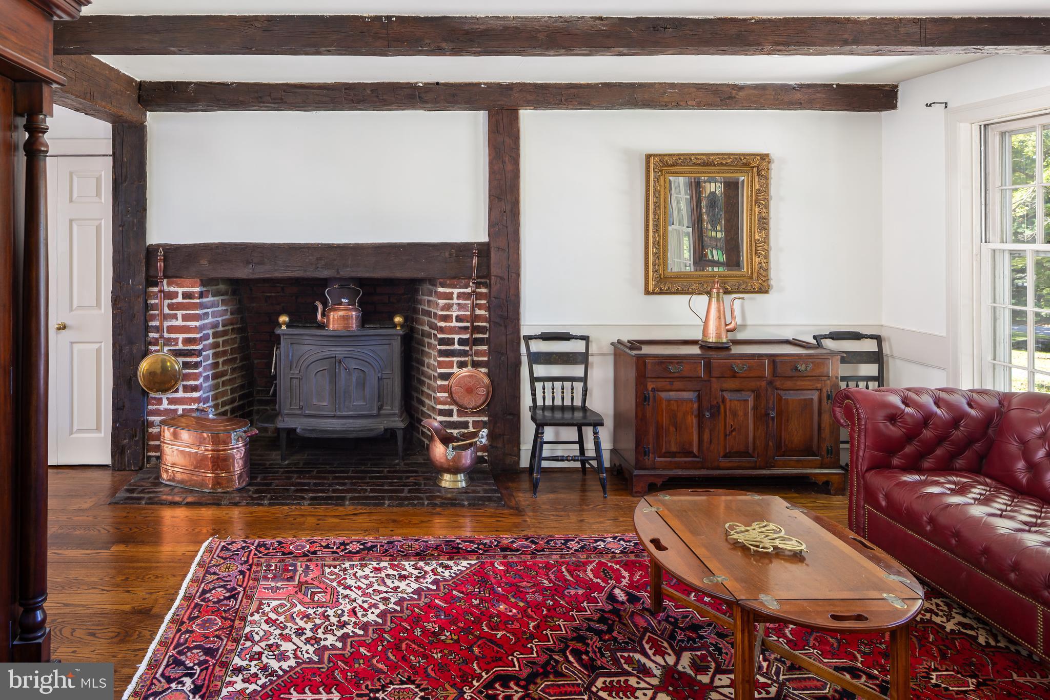 8 Fox Chase Road Malvern, PA 19355 - Photo 19 of 49 a living room with furniture a rug and a fireplace