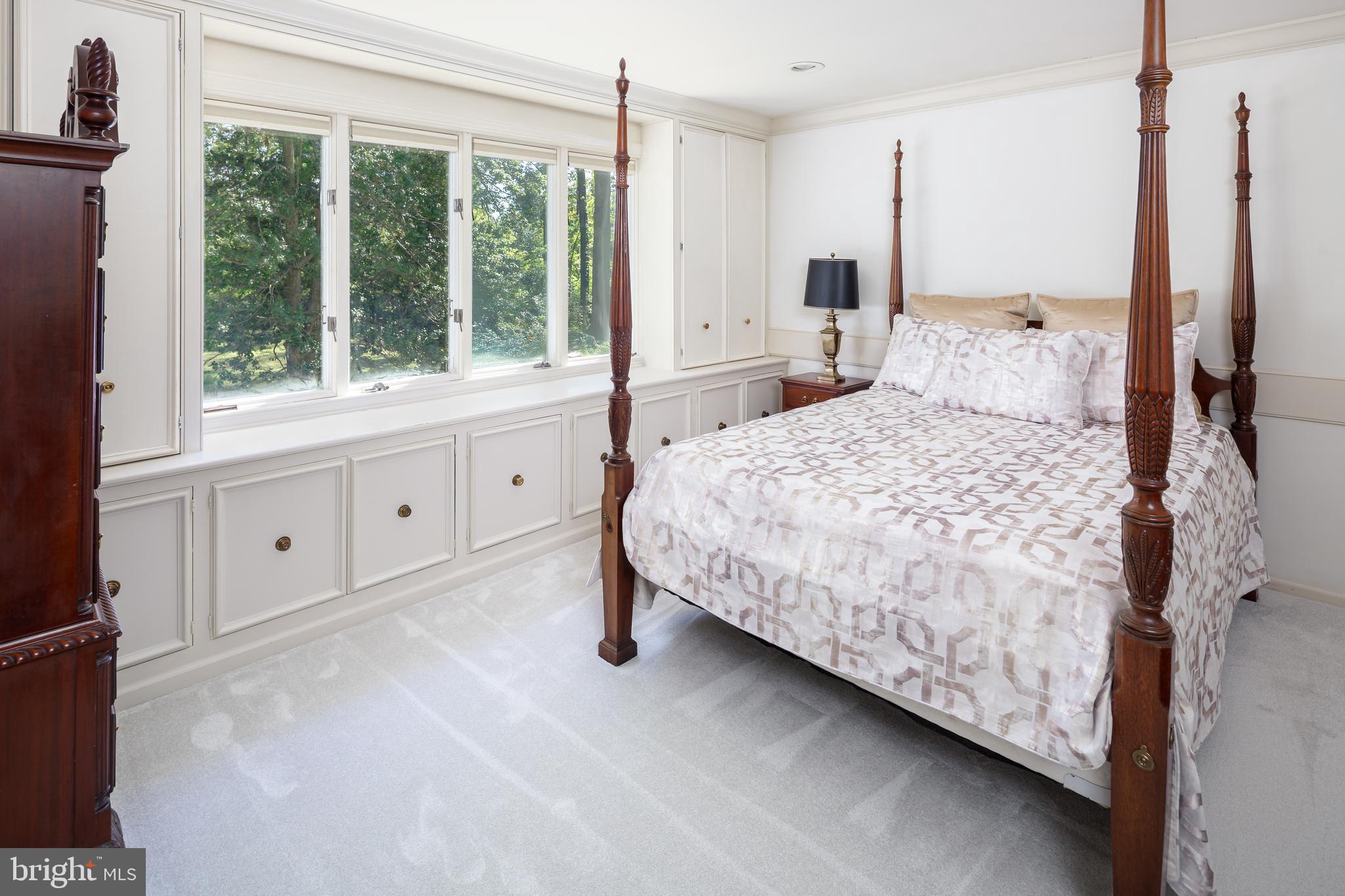 8 Fox Chase Road Malvern, PA 19355 - Photo 28 of 49 a bedroom with a large bed and a large window