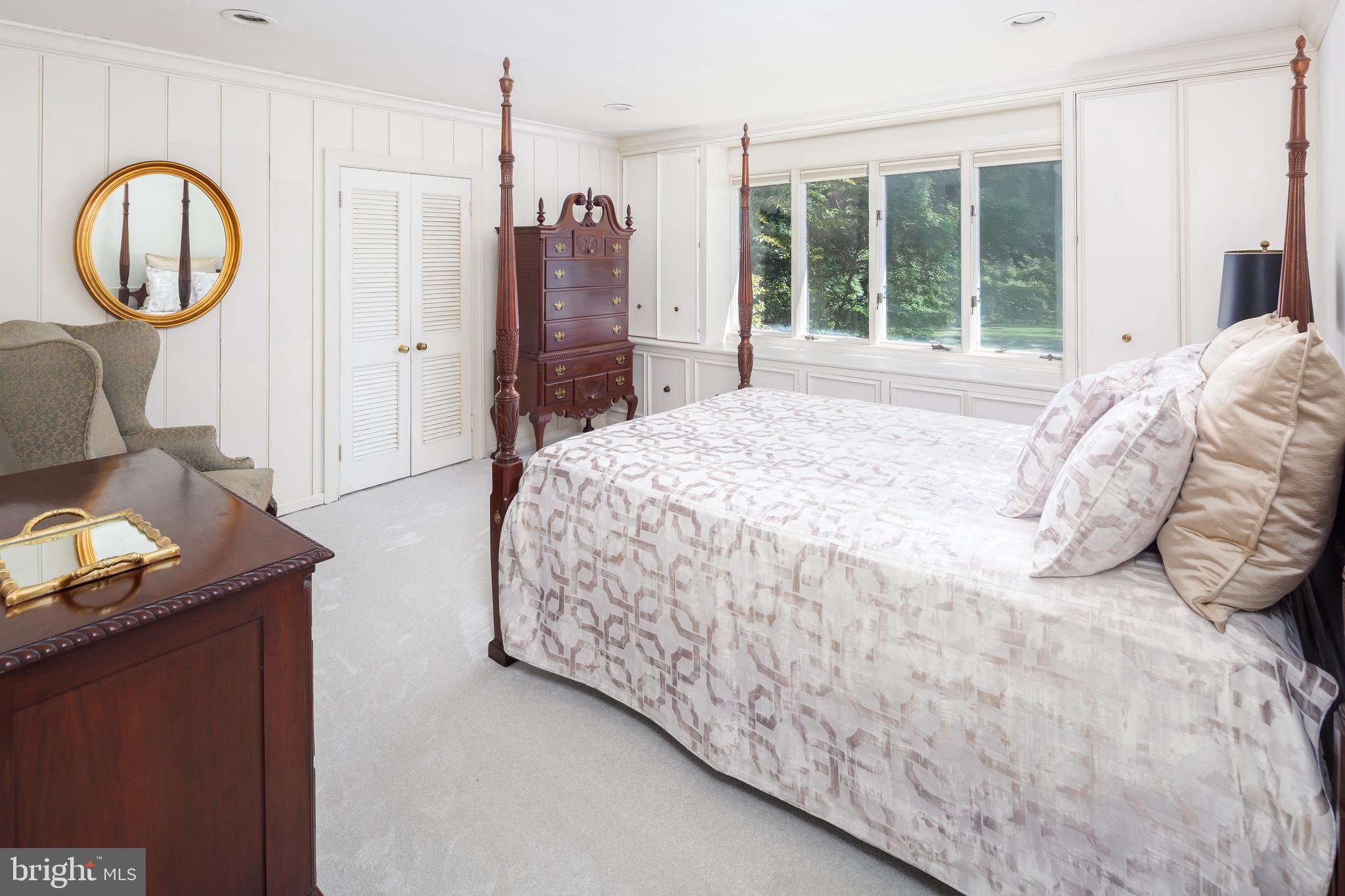 8 Fox Chase Road Malvern, PA 19355 - Photo 29 of 49 a bedroom with a bed mirror and a window