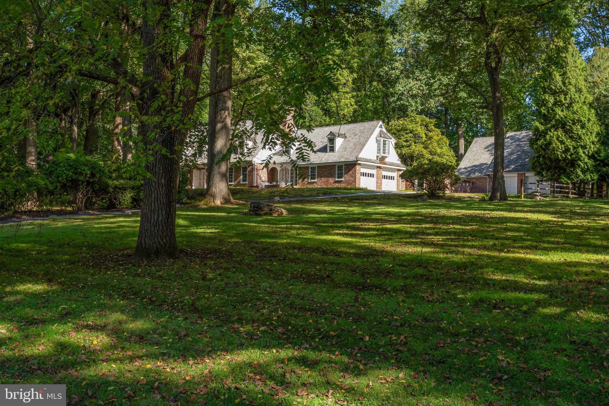 8 Fox Chase Road Malvern, PA 19355 - Photo 3 of 49 a big yard with large trees