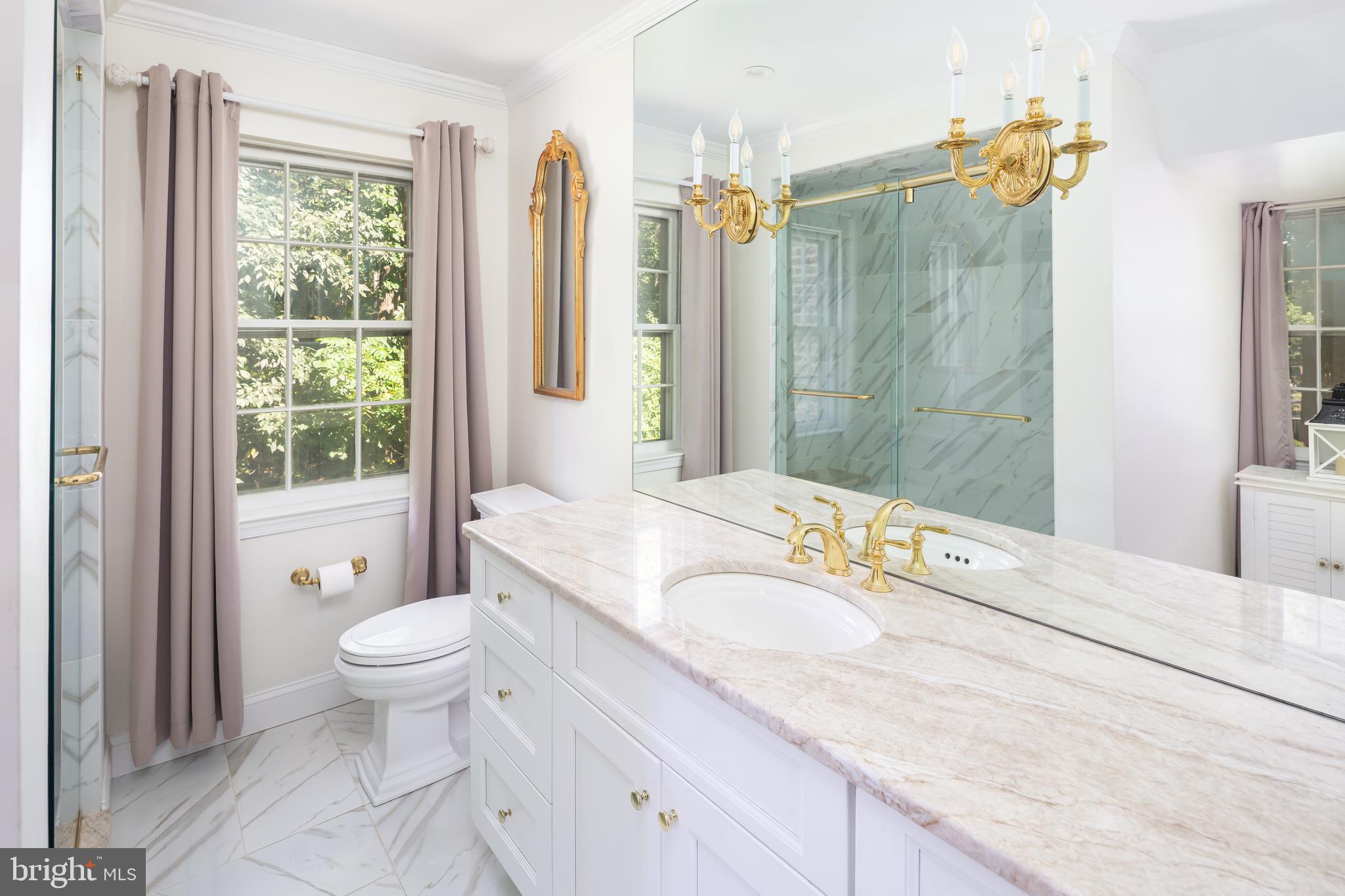 8 Fox Chase Road Malvern, PA 19355 - Photo 31 of 49 a spacious bathroom with a granite countertop sink toilet and shower