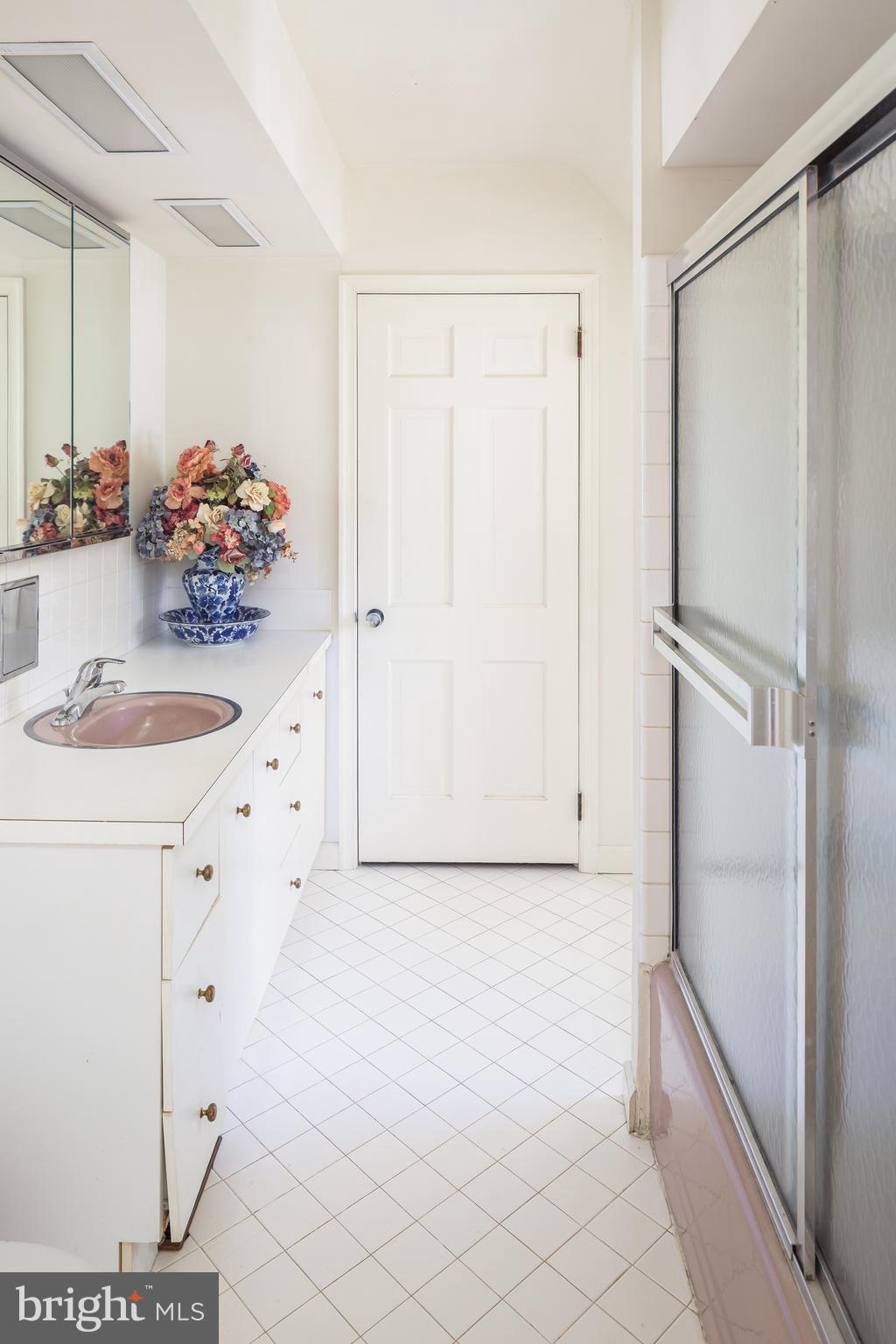 8 Fox Chase Road Malvern, PA 19355 - Photo 36 of 49 a bathroom with a sink and a mirror