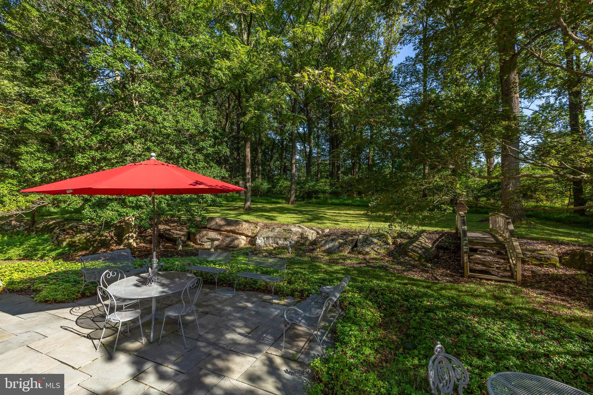 8 Fox Chase Road Malvern, PA 19355 - Photo 40 of 49 a view of a backyard with swimming pool