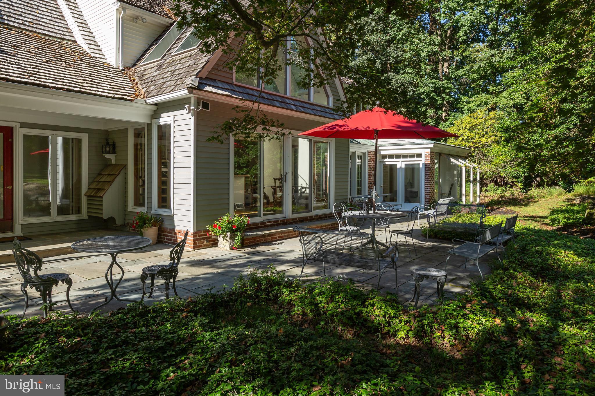 8 Fox Chase Road Malvern, PA 19355 - Photo 41 of 49 a backyard of a house with table and chairs