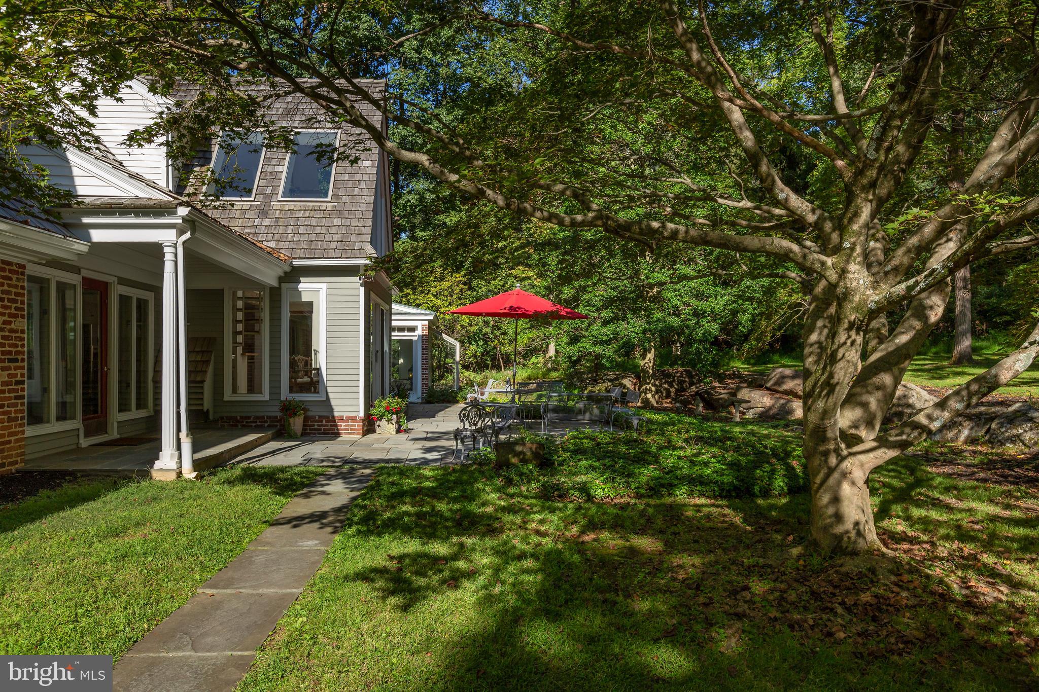 8 Fox Chase Road Malvern, PA 19355 - Photo 43 of 49 a backyard of a house with table and chairs