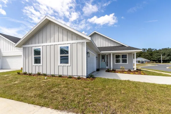 a front view of house with yard and seating area