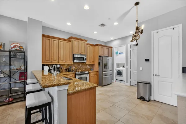 a kitchen with refrigerator cabinets and furniture