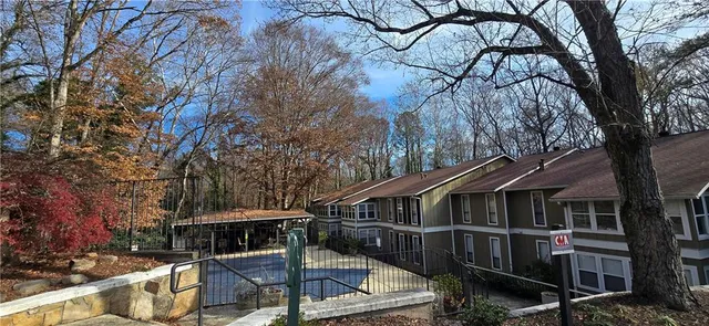 a view of house with outdoor seating and city view