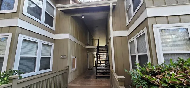 a view of a brick house many windows