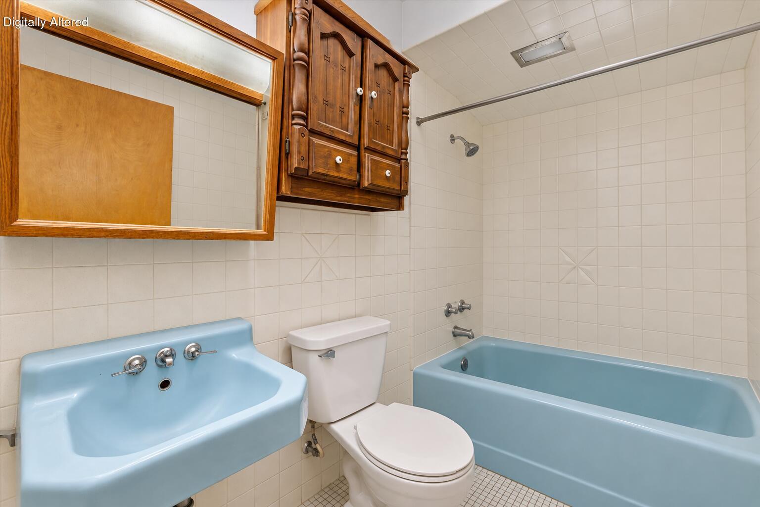 2063 Mt Pleasant Street Racine, WI 53404 - Photo 9 of 24 Vintage Blue-Tile Bathroom Interior