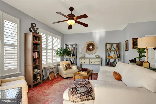 a living room with furniture and a rug