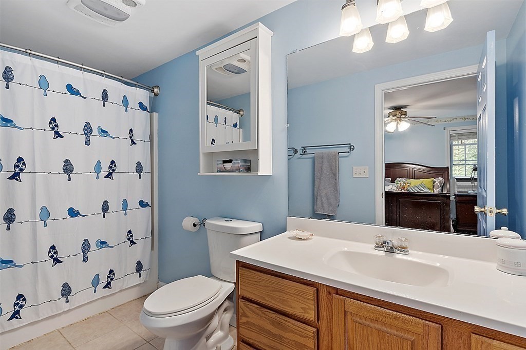 454 Loring Road Barre, MA 01005 - Photo 18 of 42 a bathroom with a sink a toilet and shower curtain
