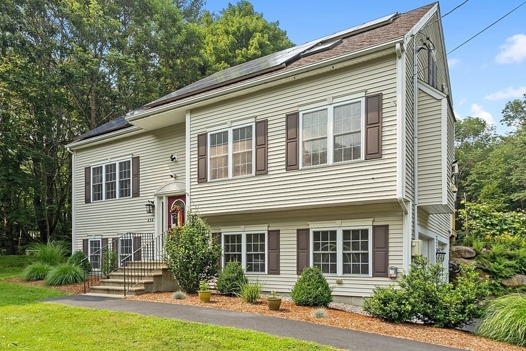 454 Loring Road Barre, MA 01005 - Photo 3 of 42 a front view of a house with garden