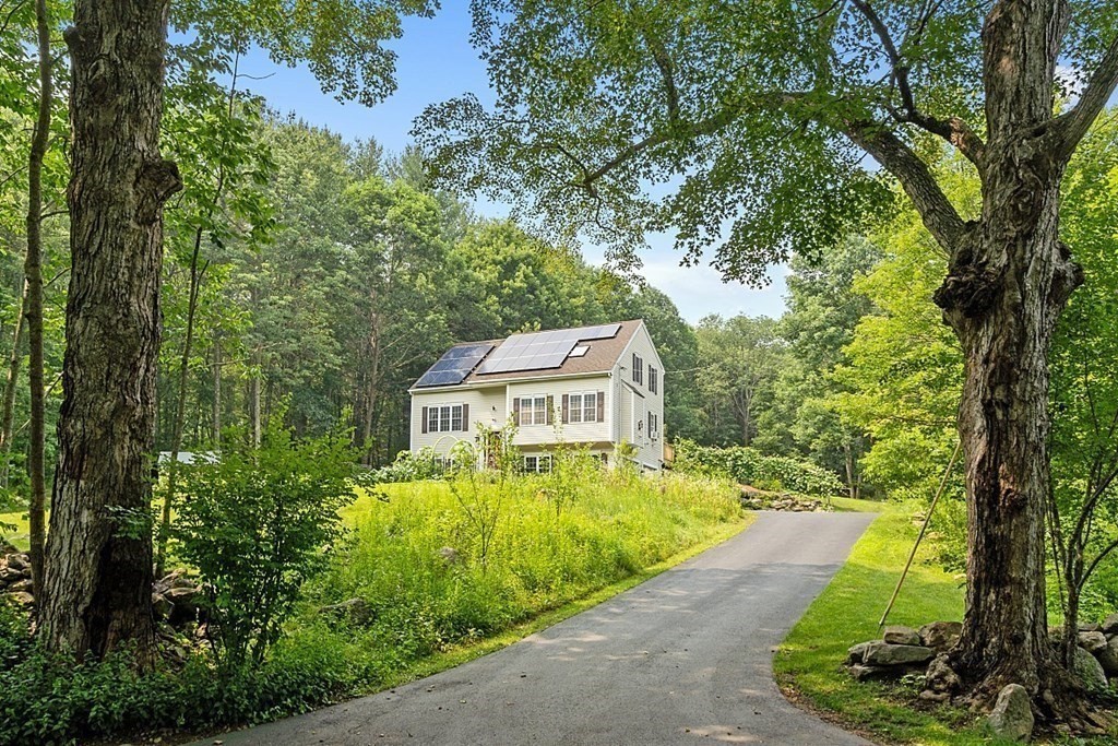 454 Loring Road Barre, MA 01005 - Photo 34 of 42 a view of a garden with large trees