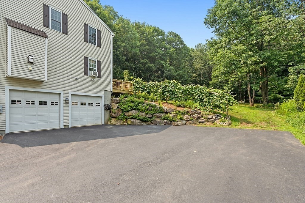 454 Loring Road Barre, MA 01005 - Photo 39 of 42 a view of a house with a yard and potted plants