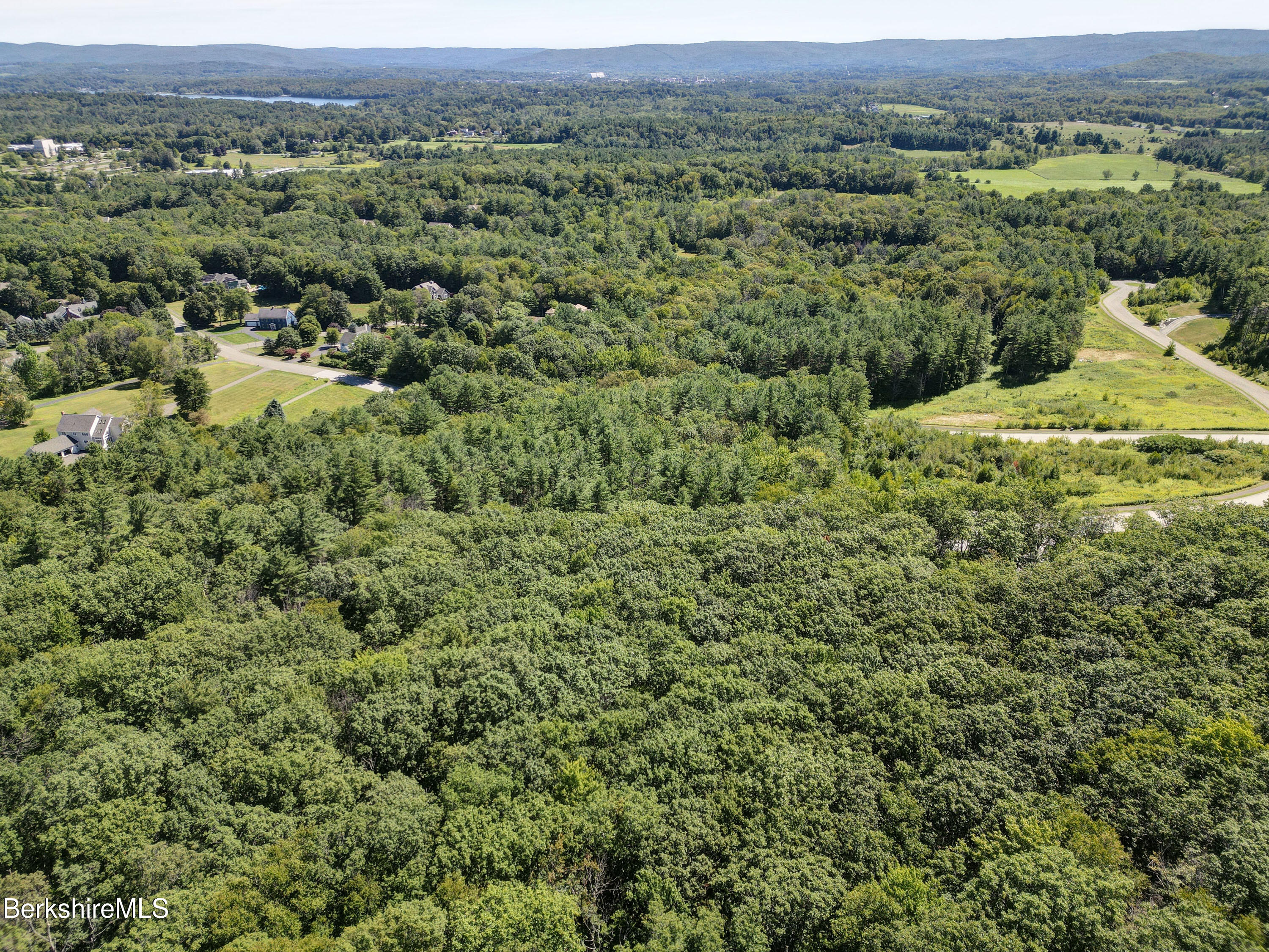 Lot #26 Old Farm Road Pittsfield, MA 01201 - Photo 8 of 8 an aerial view of a houses with a lush green hillside