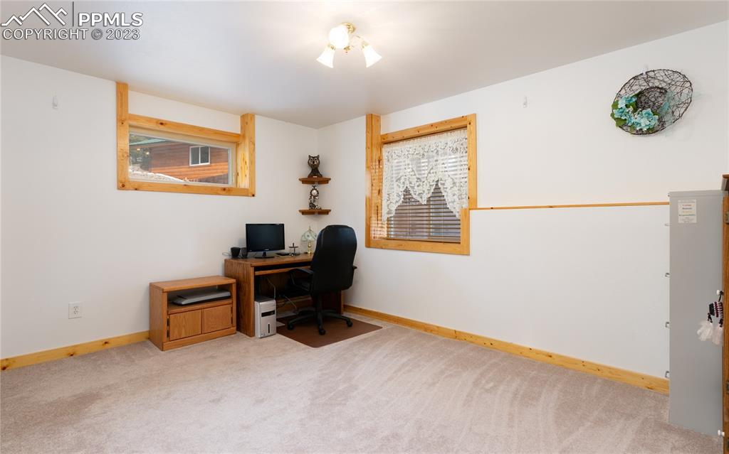 1321 Bristlecone Road Guffey, CO 80820 - Photo 28 of 37 a view of a workspace with furniture and a window