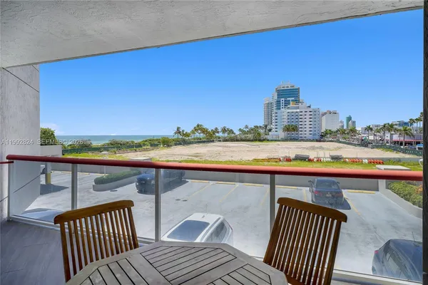 a view of a roof deck with wooden floor and fence