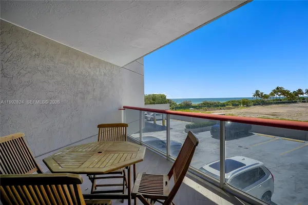 a view of a chairs and table in patio