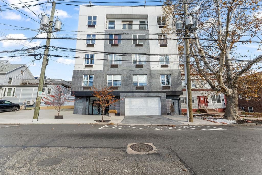 43-45 West 32nd Street, Unit 503 Bayonne, NJ 07002 - Photo 17 of 19 a view of a building with a street