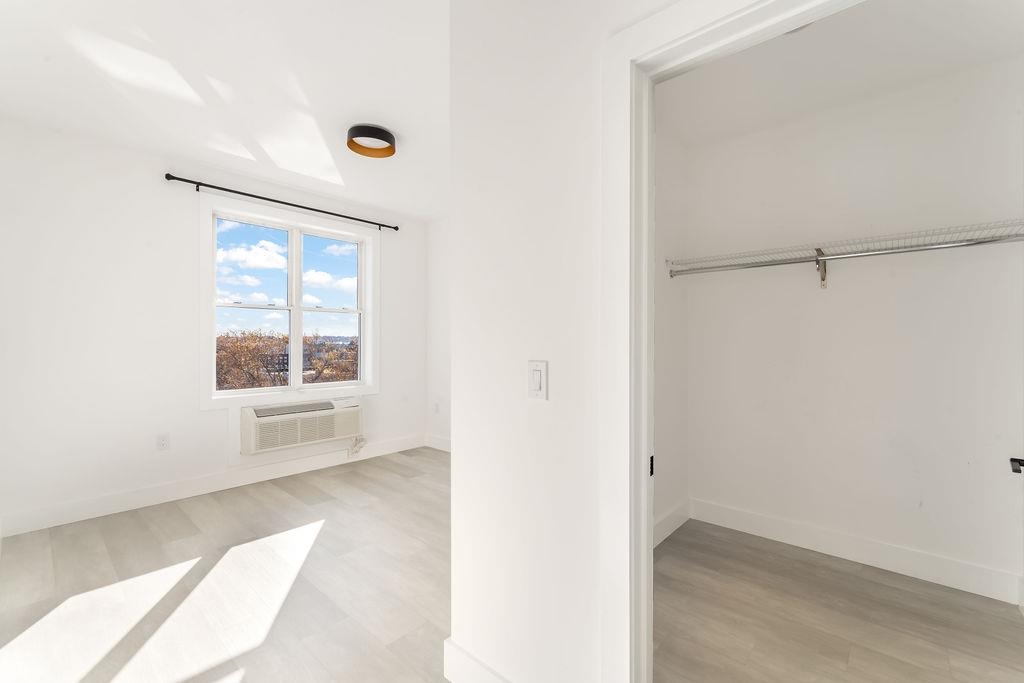 43-45 West 32nd Street, Unit 503 Bayonne, NJ 07002 - Photo 7 of 19 a view of an empty room with a window