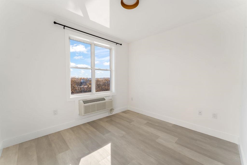 43-45 West 32nd Street, Unit 503 Bayonne, NJ 07002 - Photo 9 of 19 a view of an empty room with a window