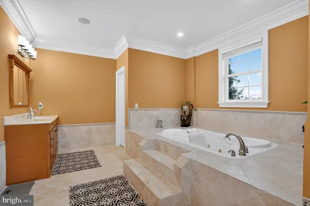 a bathroom with a bathtub and a sink