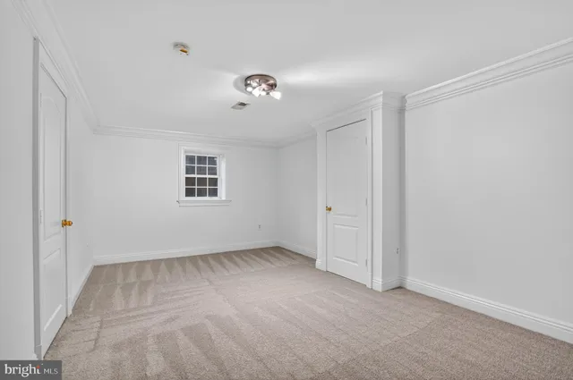 a view of room with a ceiling fan