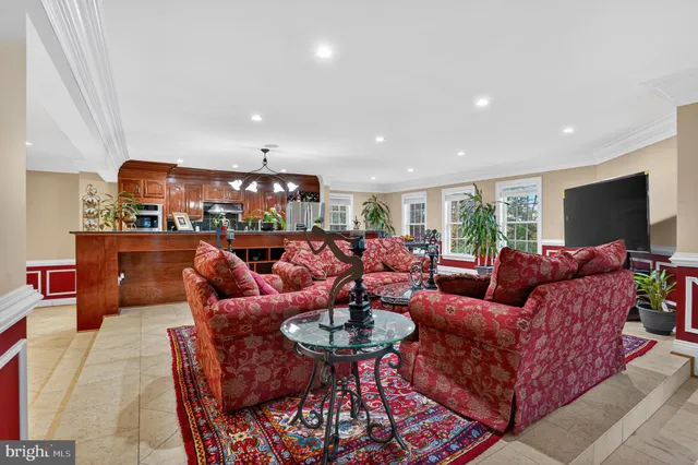 a living room with furniture a flat screen tv and rug