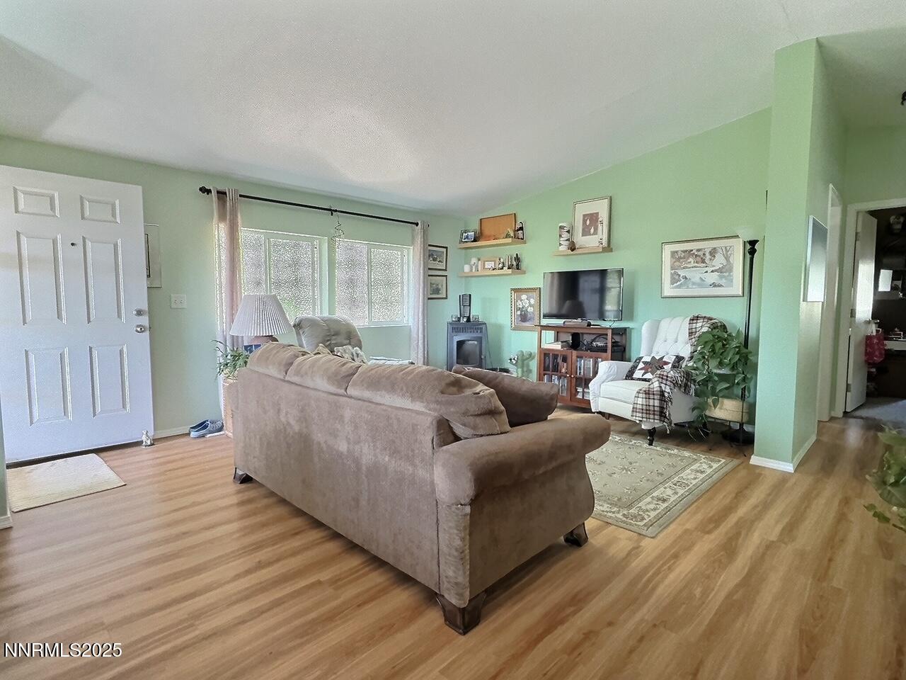 113 Victorine Drive Kingston, NV 89310 - Photo 11 of 44 a living room with furniture and a fireplace