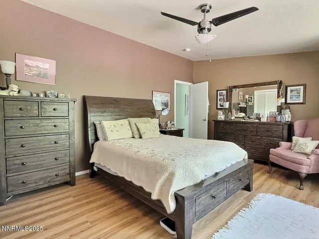 a bedroom with bed and window