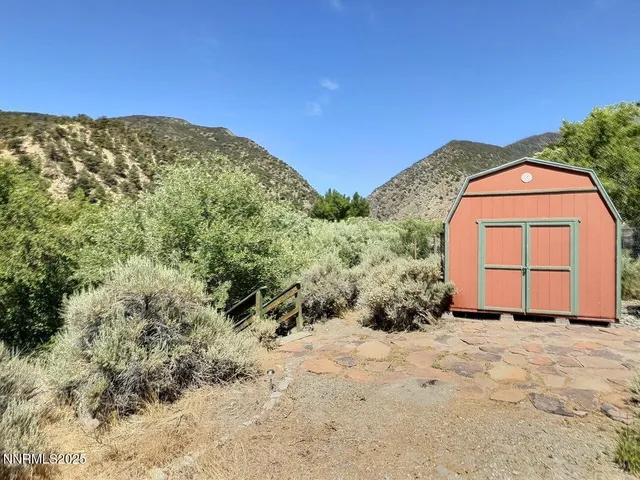 a view of a backyard of the house
