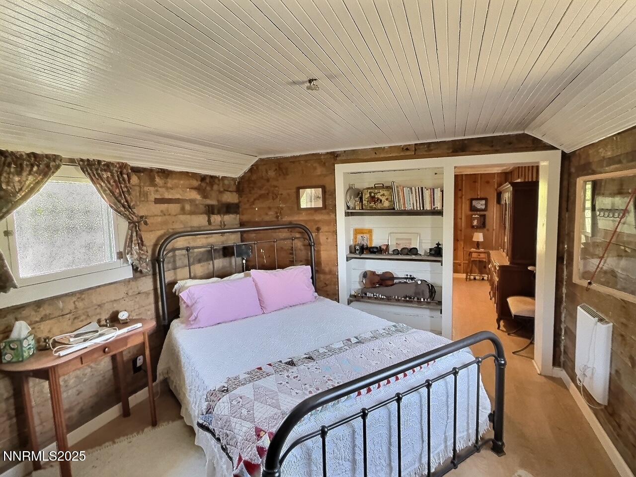 113 Victorine Drive Kingston, NV 89310 - Photo 26 of 44 a bedroom with a bed and wooden floor