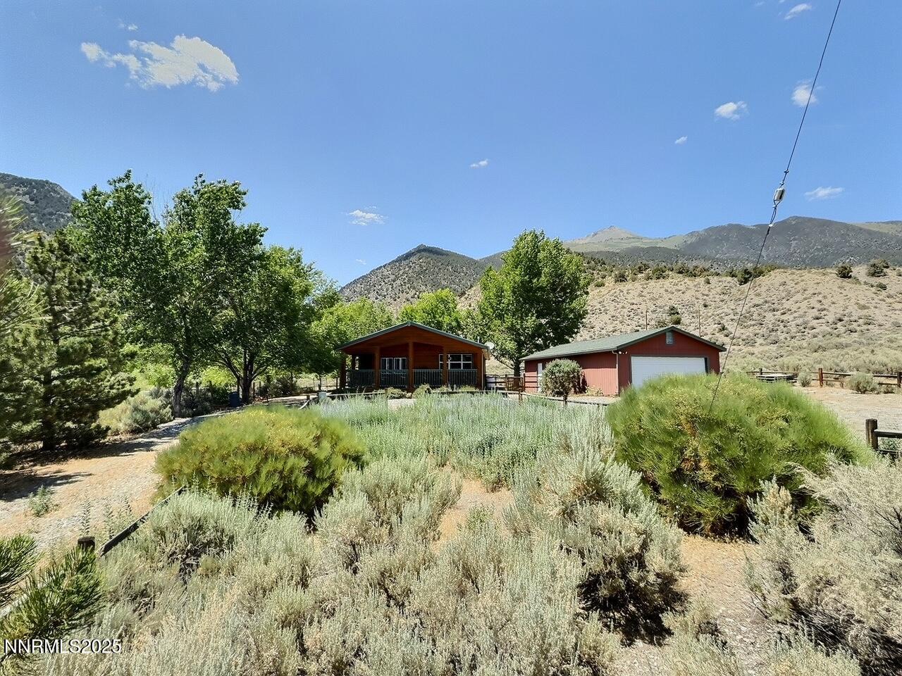113 Victorine Drive Kingston, NV 89310 - Photo 3 of 44 a backyard of a house with a yard and outdoor seating