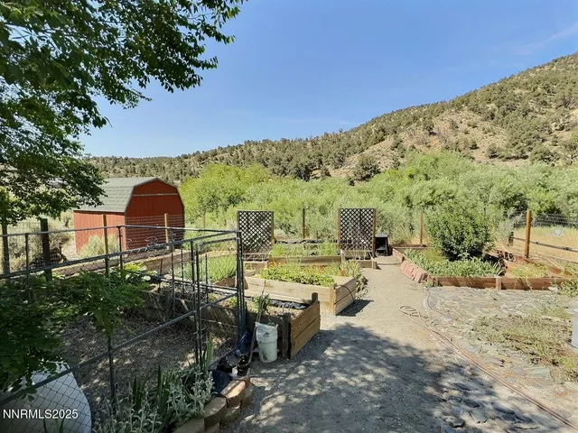 a view of a backyard with sitting area