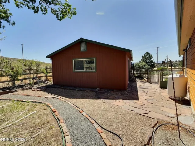 a house view with a backyard space