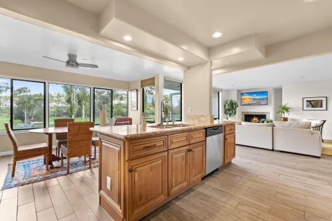 a large kitchen with lots of counter top space and living room