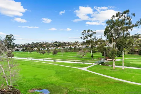 a view of a golf course with a lake