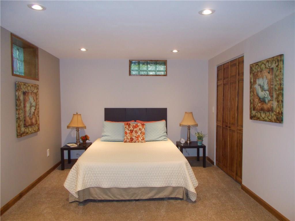 121 Mary Reed Road Baden, PA 15005 - Photo 15 of 24 3rd Bedroom. Lower level. S-P-R-E-A-D-O-U-T! 11x25. Versatile space for whatever is needed. Freshly painted and new wall-to-wall carpeting.