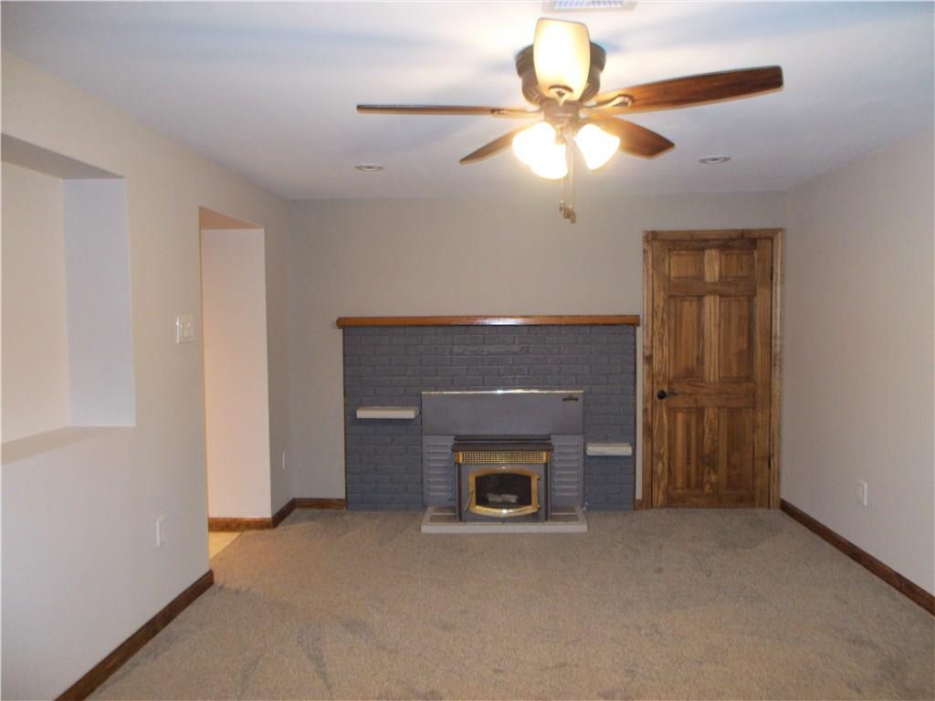 121 Mary Reed Road Baden, PA 15005 - Photo 18 of 24 Family Room. Lower level. 12x17. The perfect spot for a "cave". Enjoy entertaining and cheering on your favorite sports teams. The wood-burning fireplace provides a comfortable amenity.