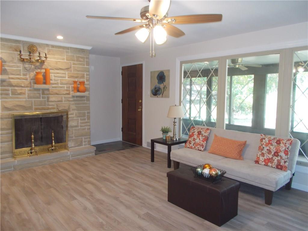 121 Mary Reed Road Baden, PA 15005 - Photo 6 of 24 Living Room. Main level, 13x18. Nicely updated with engineered hardwood and Hunter ceiling fan.