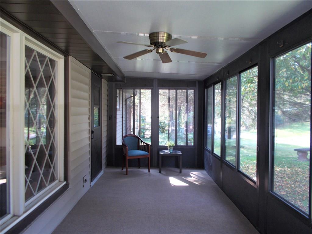 121 Mary Reed Road Baden, PA 15005 - Photo 8 of 24 3-Season Room. 8x22. Located at the front entrance. A great place to slow down and enjoy living. Features screened windows, outdoor carpeting, and overhead fan for comfort. Could be used for dining in the Spring, Summer, and Fall.