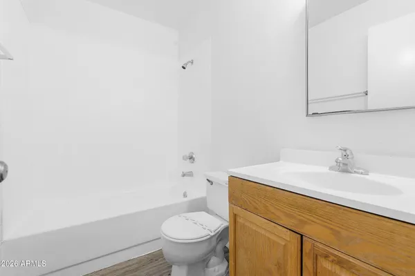 a bathroom with a sink toilet and vanity