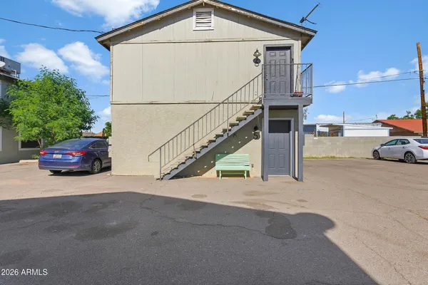 a view of a car park in front of house