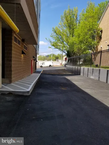 a living room with a large window and furniture