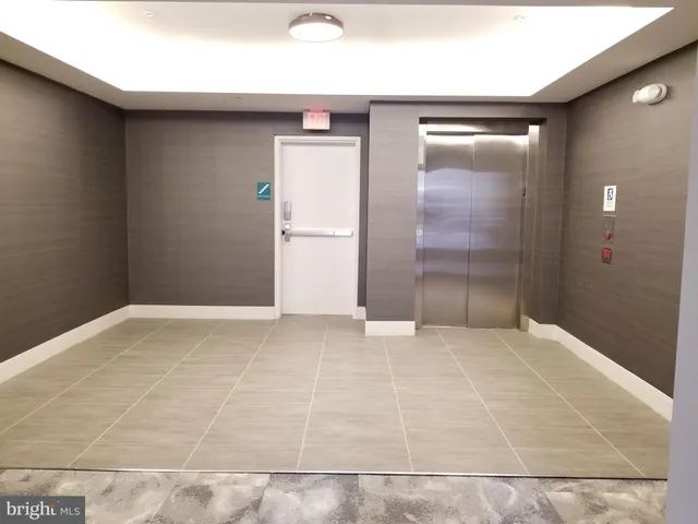 a bathroom with a toilet a sink and a mirror