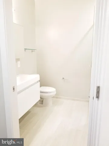 a view of kitchen with refrigerator and stove