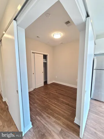 a view of balcony with wooden floor and city view