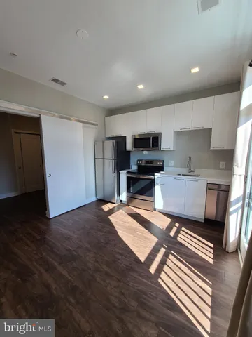 a view of a patio with table and chairs